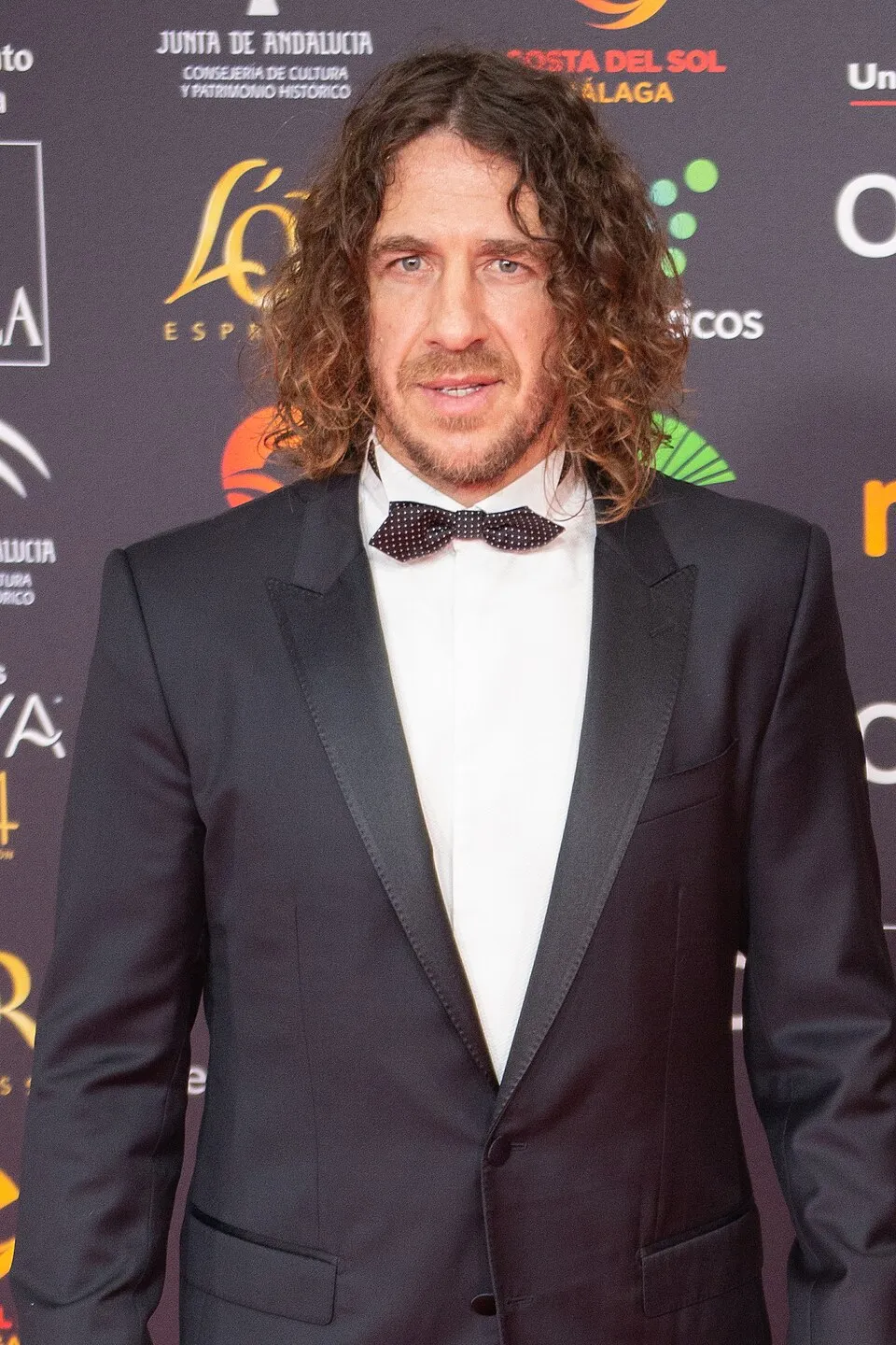Carles Puyol merayakan kemenangan bersama Barcelona dan timnas Spanyol