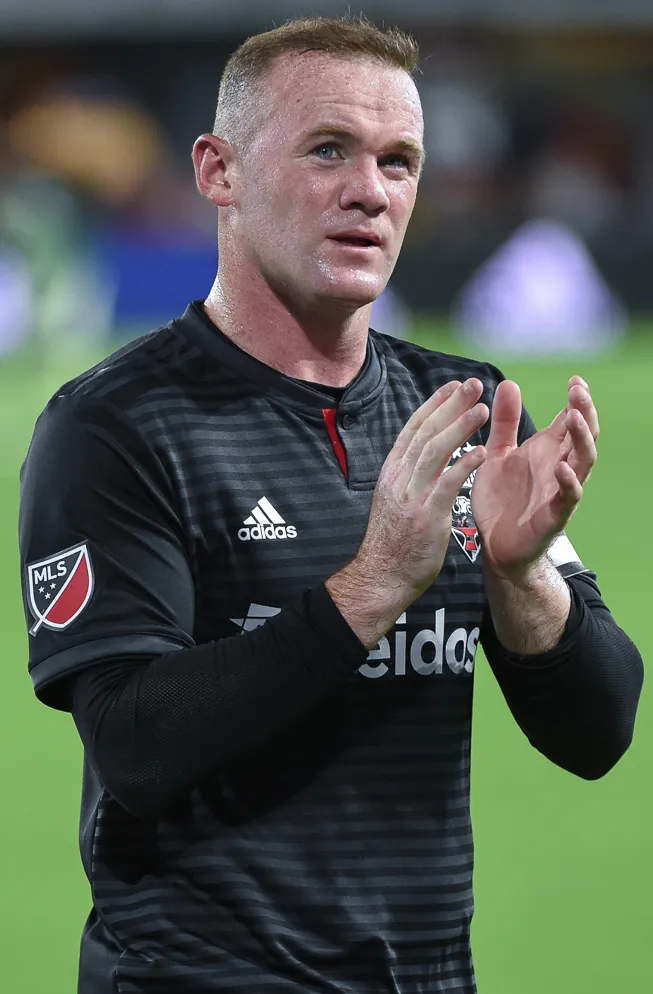 Wayne Rooney saat mengenakan seragam kebesaran Manchester United